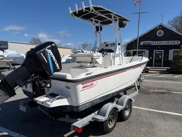 Slide: The Image of 2005 Boston Whaler 190 Nantucket boat on trailer, parked near sales office. - 3