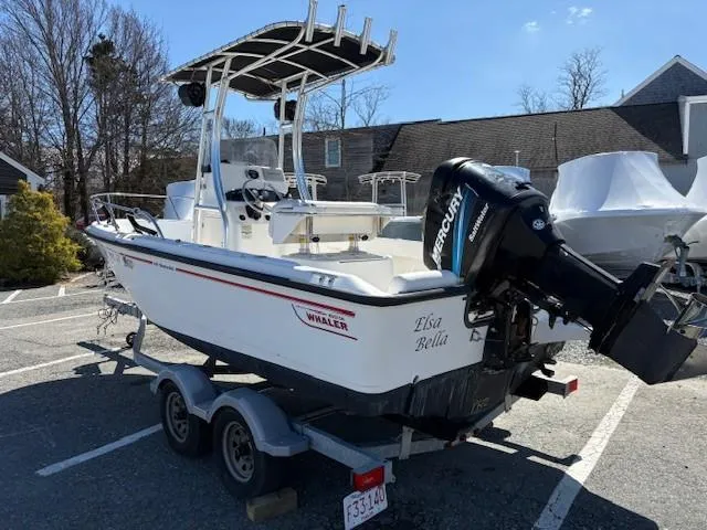 Slide: The Image of 2005 Boston Whaler 190 Nantucket boat on trailer with Mercury outboard motor. - 4