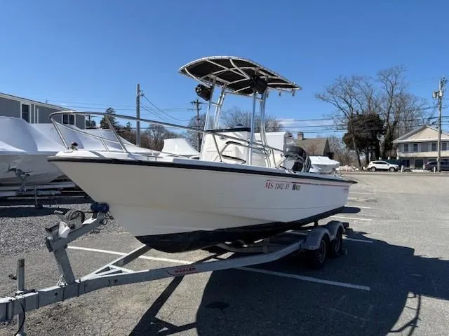 Slide: The Image of 2005 Boston Whaler 190 Nantucket boat on trailer in parking lot. - 6