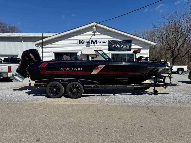 Slide: The Image of 2022 Vexus DVX20S boat on trailer outside marine dealership. - 1