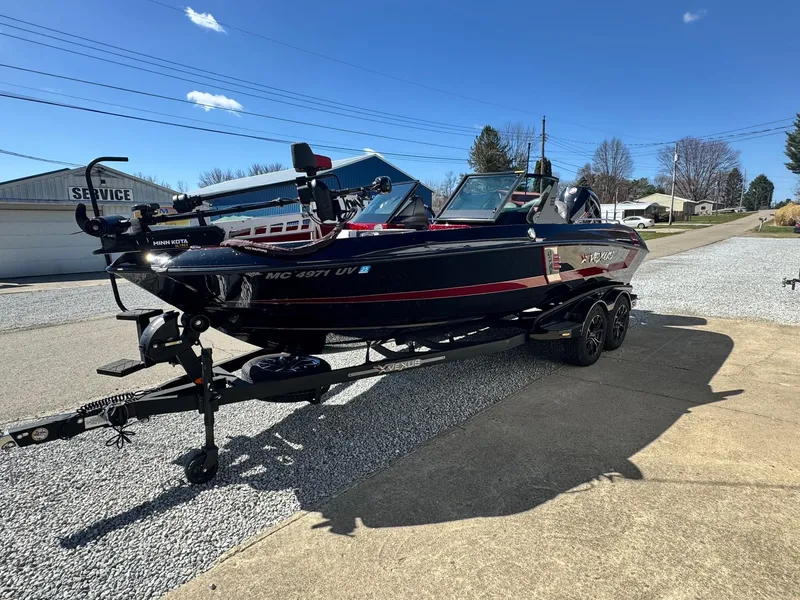 Slide: The Image of 2022 Vexus DVX20S boat on trailer, parked outdoors on a sunny day. - 11