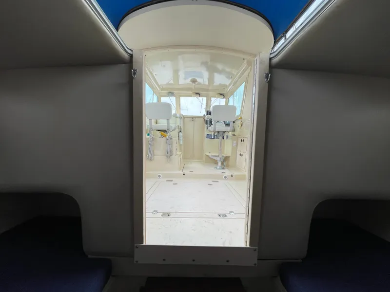 Slide: The Image of Interior view of 2004 Albin 30 Family Cruiser, showcasing cabin and helm area. - 26