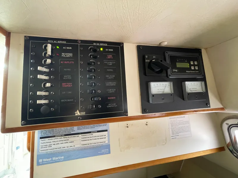 Slide: The Image of Electrical control panel on a 2004 Albin 30 Family Cruiser boat. - 38