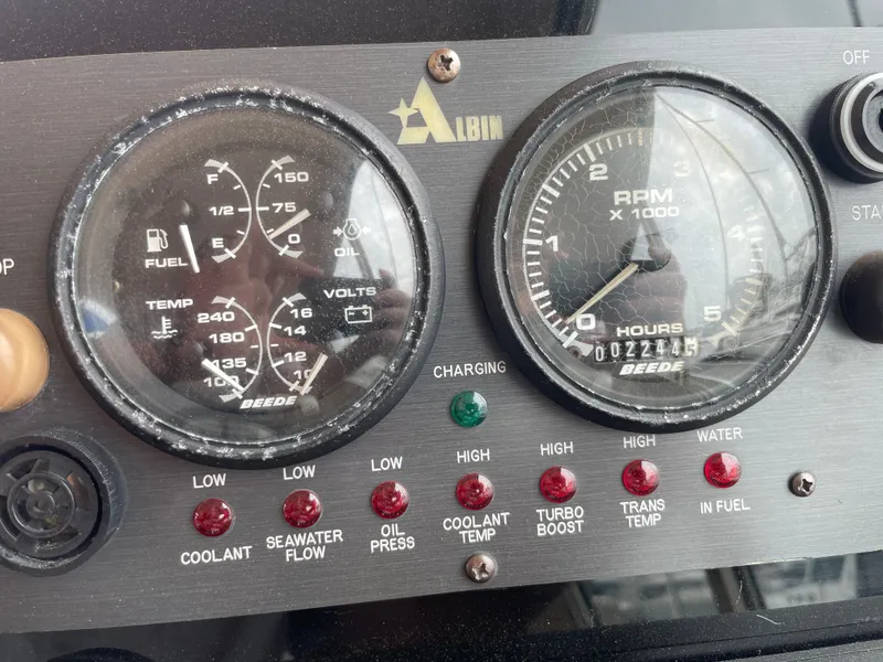 Slide: The Image of Instrument panel of a 2004 Albin 30 Family Cruiser with gauges and indicator lights. - 39