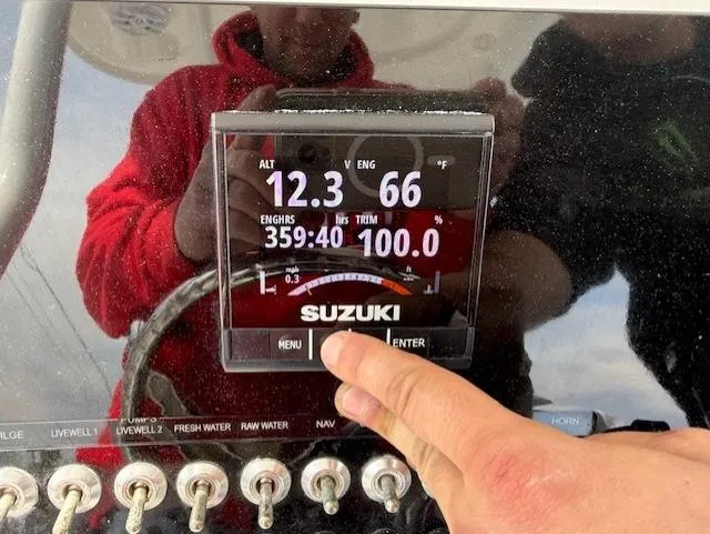 Slide: The Image of Close-up of Suzuki engine display on 2018 Sea Pro 239 Center Console boat. - 10