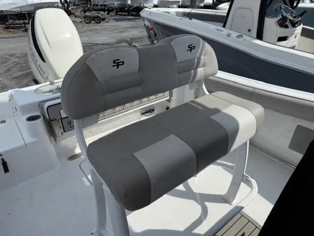 Slide: The Image of 2018 Sea Pro 239 Center Console boat with gray seating and white deck. - 11