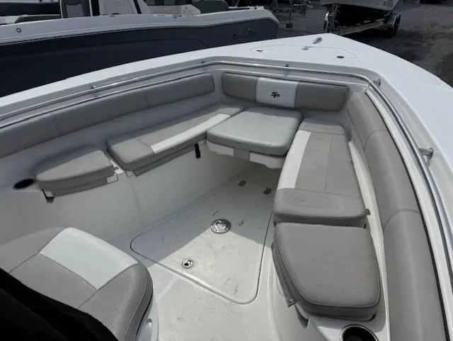 Slide: The Image of 2018 Sea Pro 239 Center Console boat with spacious seating area. - 13