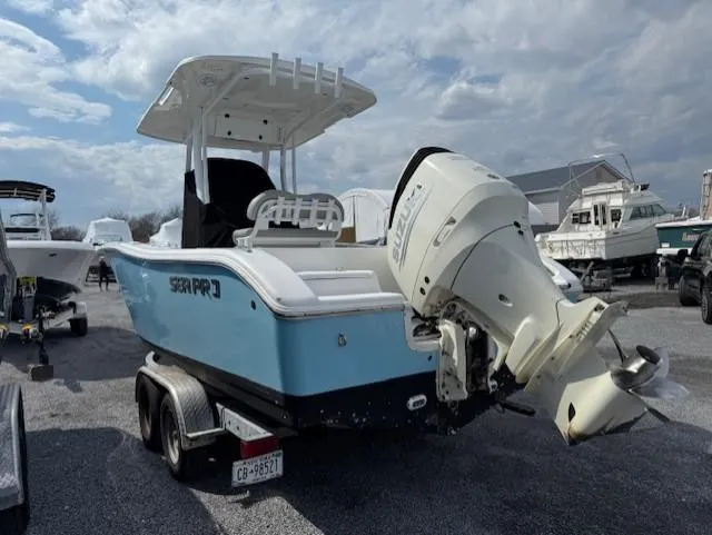 Slide: The Image of 2018 Sea Pro 239 Center Console boat on trailer, parked in marina lot. - 4