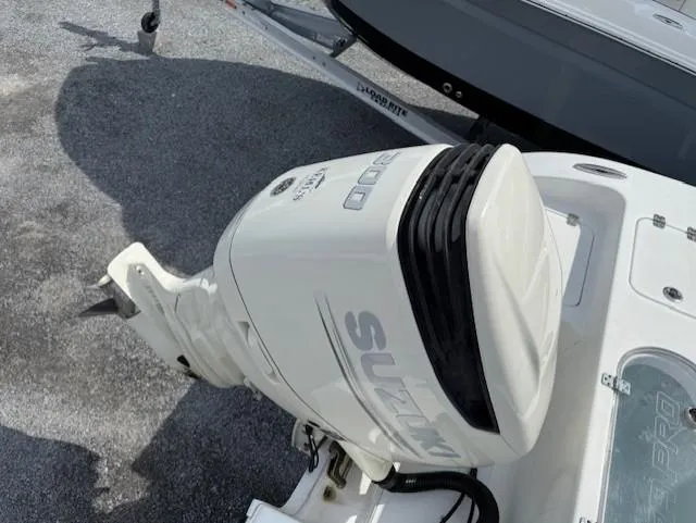 Slide: The Image of 2018 Sea Pro 239 Center Console with Suzuki outboard motor, parked on a trailer. - 6