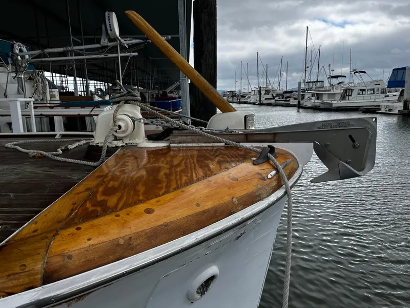 Slide: The Image of 1948 Chris-Craft Double Cabin boat docked at a marina with other vessels. - 11