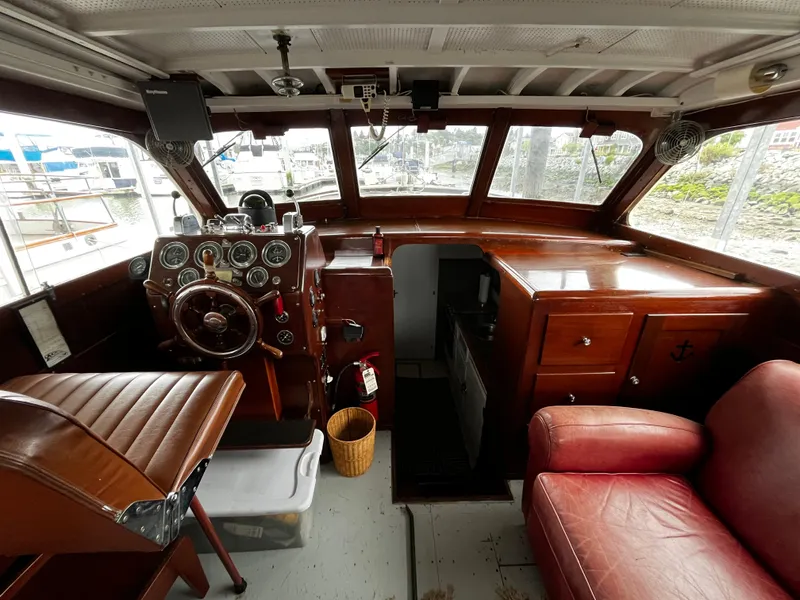 Slide: The Image of 1948 Chris-Craft Double Cabin interior with vintage steering wheel and gauges. - 24