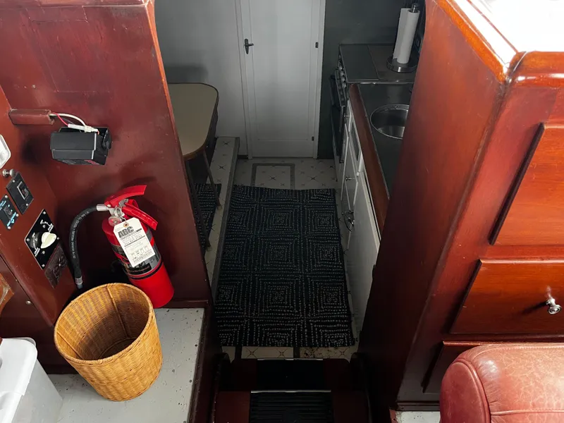 Slide: The Image of 1948 Chris-Craft Double Cabin interior with wood paneling, kitchen area, and fire extinguisher. - 29