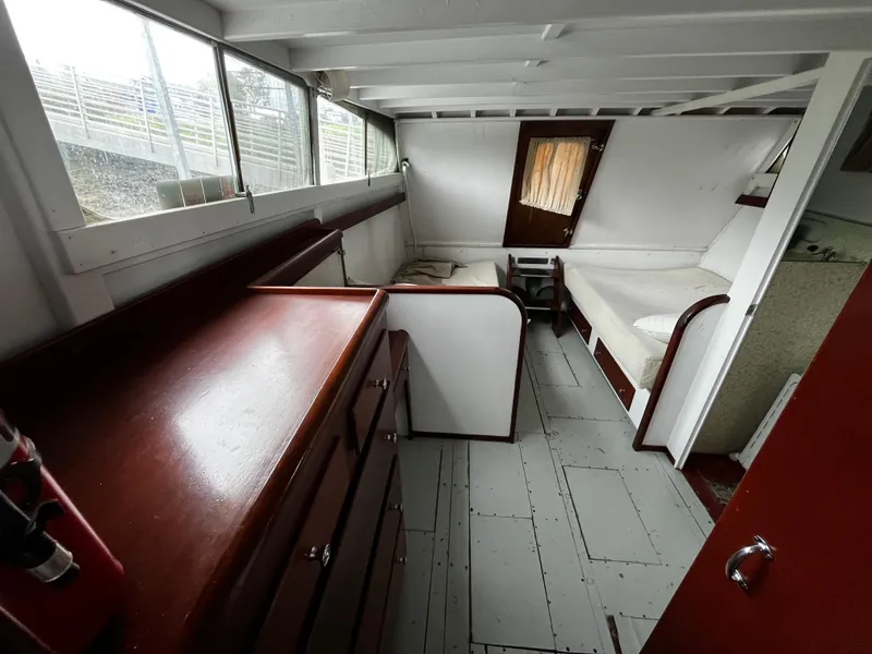 Slide: The Image of 1948 Chris-Craft Double Cabin interior with wooden furnishings and seating area. - 39