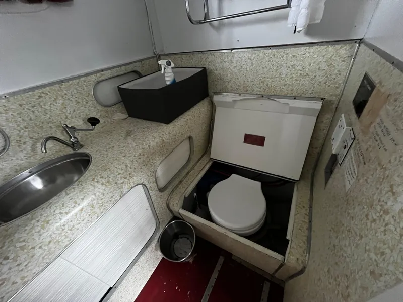 Slide: The Image of 1948 Chris-Craft Double Cabin bathroom with sink, toilet, and countertop. - 47