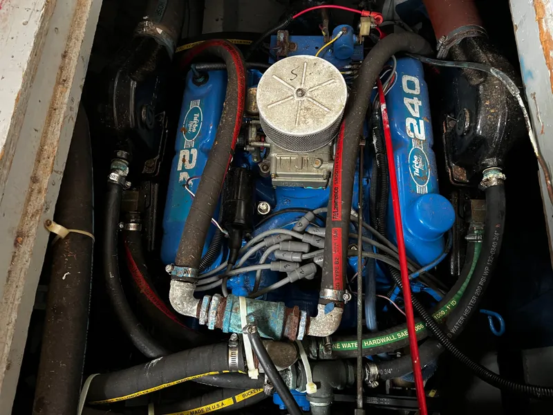 Slide: The Image of Engine of 1948 Chris-Craft Double Cabin boat, featuring blue components and visible wiring. - 48