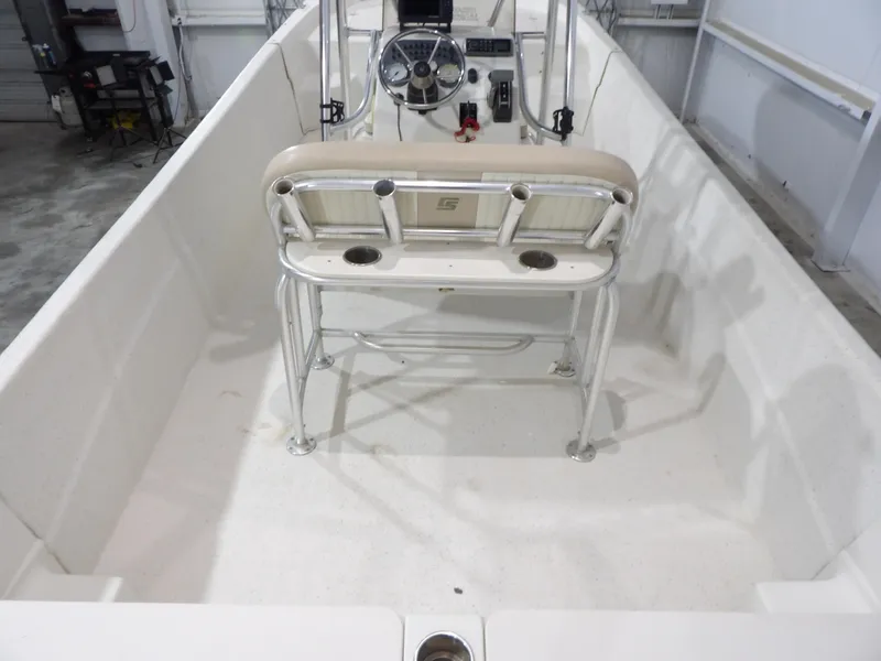 Slide: The Image of 2013 Carolina Skiff 238 DLV boat interior with steering console and seating. - 17