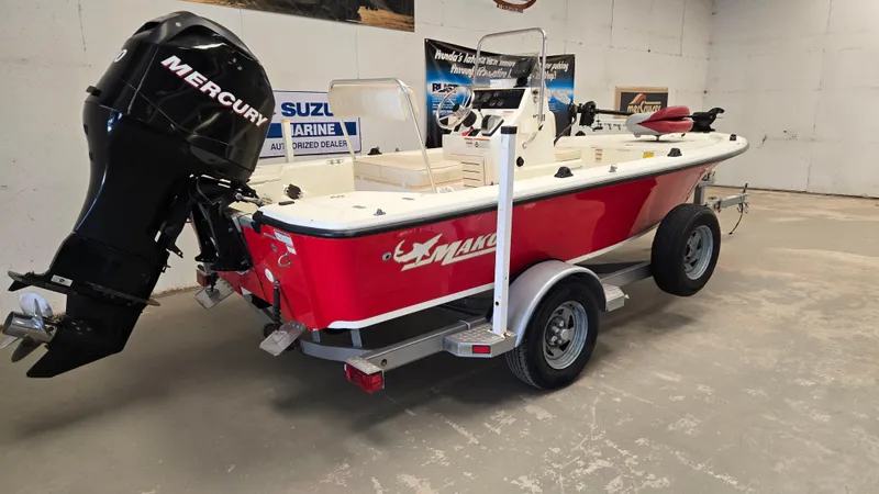 Slide: The Image of 2008 Mako Inshore 1801 boat with Mercury engine on trailer in showroom. - 1