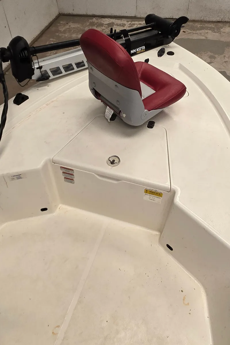 Slide: The Image of 2008 Mako Inshore 1801 boat with red seat and trolling motor. - 13