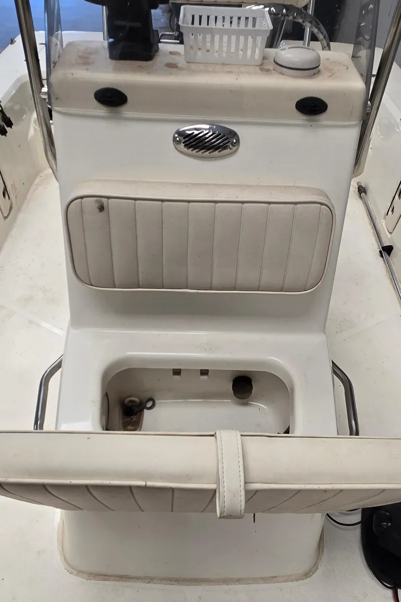 Slide: The Image of 2008 Mako Inshore 1801 boat console with seating and storage compartment. - 14