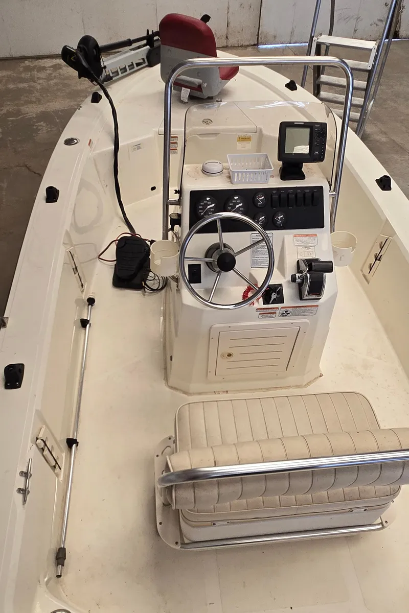 Slide: The Image of 2008 Mako Inshore 1801 boat interior with steering console and seating. - 15