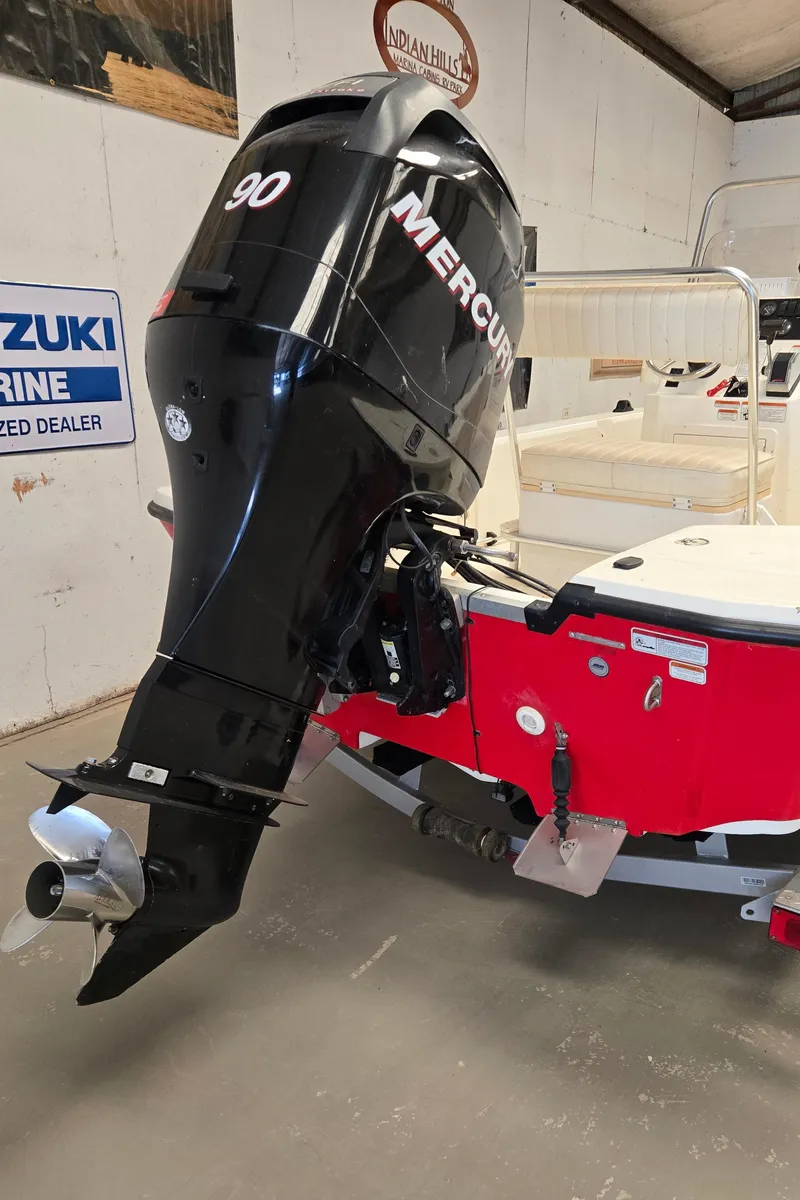 Slide: The Image of 2008 Mako Inshore 1801 boat with Mercury 90 outboard motor in a showroom. - 16