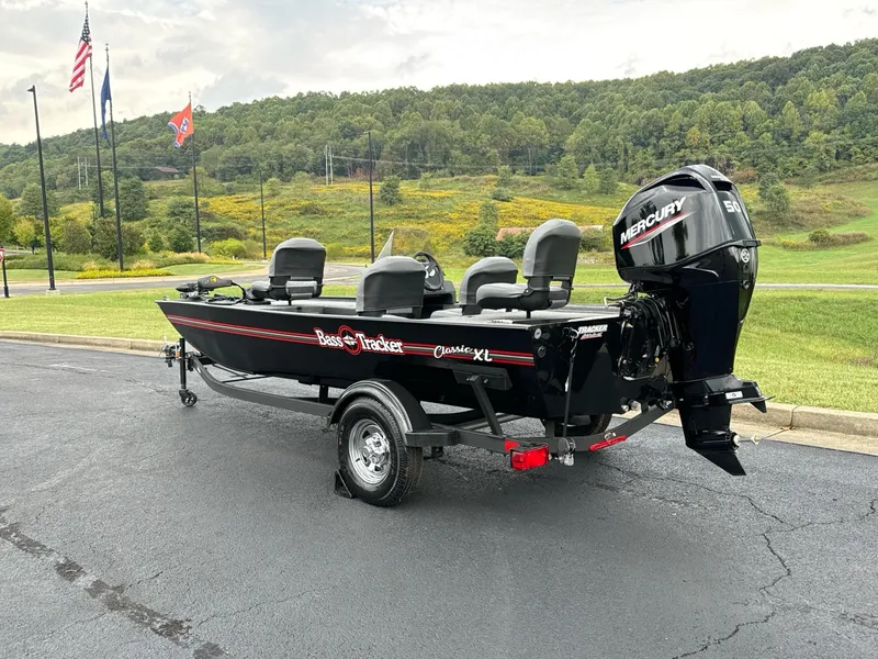 Slide: The Image of 2025 Tracker Bass Tracker Classic XL boat with Mercury engine on a trailer. - 3