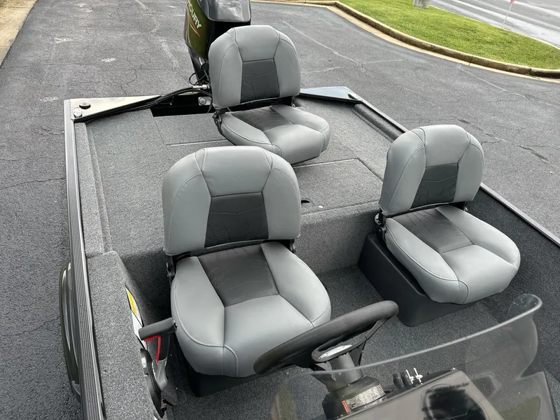 Slide: The Image of 2025 Tracker Bass Tracker Classic XL boat interior with three gray seats. - 5