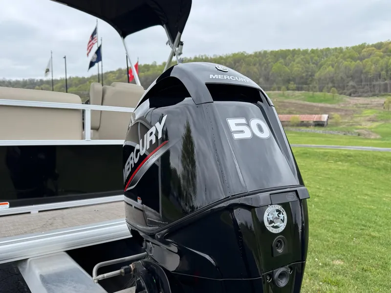 Slide: The Image of 2025 Sun Tracker Party Barge 16 DLX with Mercury 50 outboard motor, scenic background. - 8