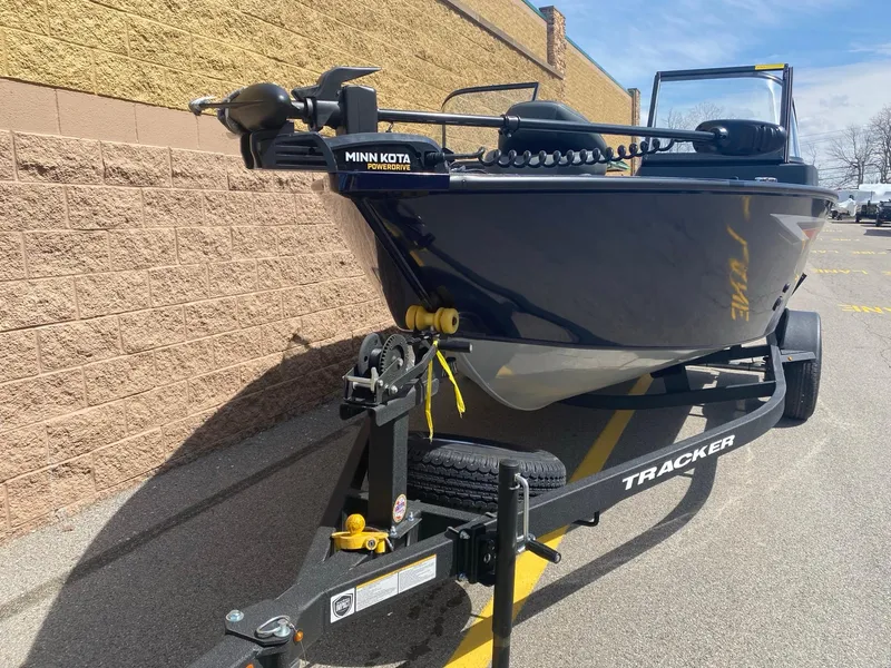Slide: The Image of 2025 Tracker Pro Guide V-175 Combo boat on trailer, featuring Minn Kota trolling motor. - 2