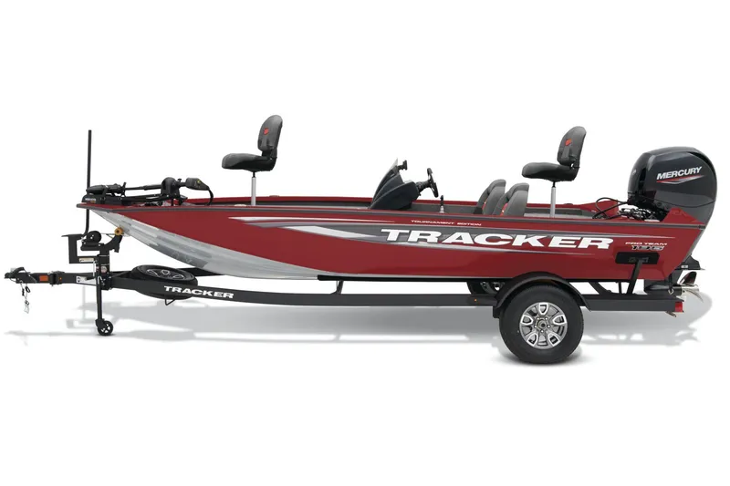 Slide: The Image of 2025 Tracker Pro Team 195 Tournament Edition boat with powerful engine, parked outdoors. - 2