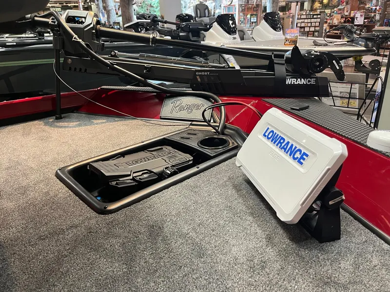 Slide: The Image of 2025 Ranger RT178 boat interior with Lowrance fish finder and storage compartment. - 4