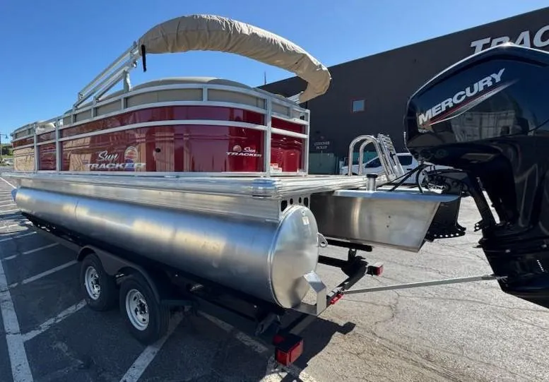 Slide: The Image of 2025 Sun Tracker Party Barge 20 DLX pontoon boat with Mercury engine on trailer. - 3