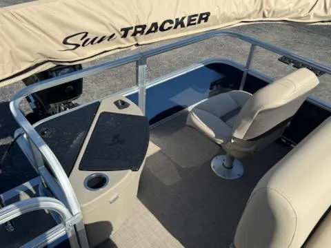 Slide: The Image of 2025 Sun Tracker Bass Buggy 18 DLX interior with seating and console. - 8