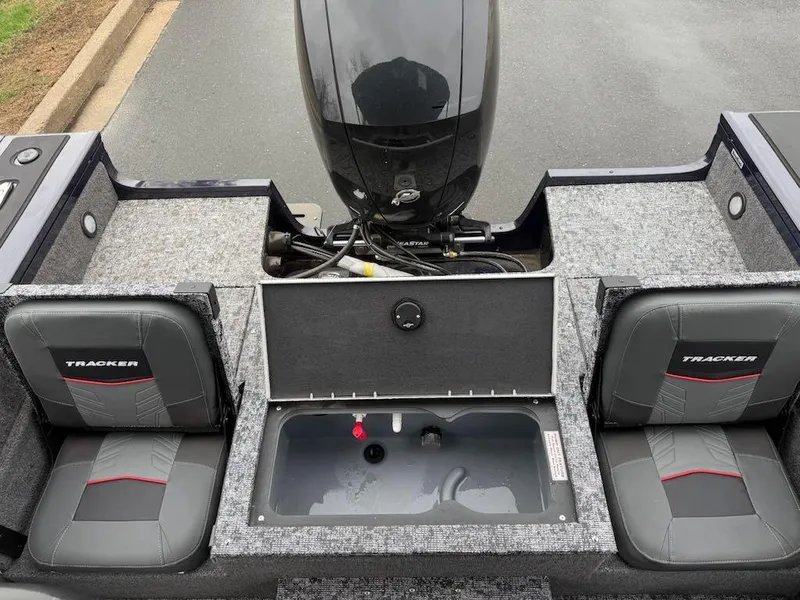 Slide: The Image of 2025 Tracker Targa V-18 Combo boat interior with seating and motor view. - 3
