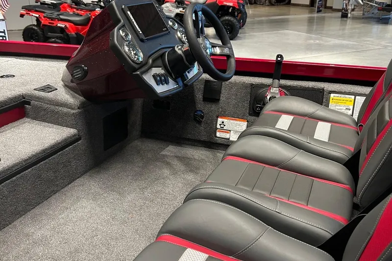 Slide: The Image of 2025 Ranger RT178 boat interior with steering console and seating, featuring modern design and controls. - 2