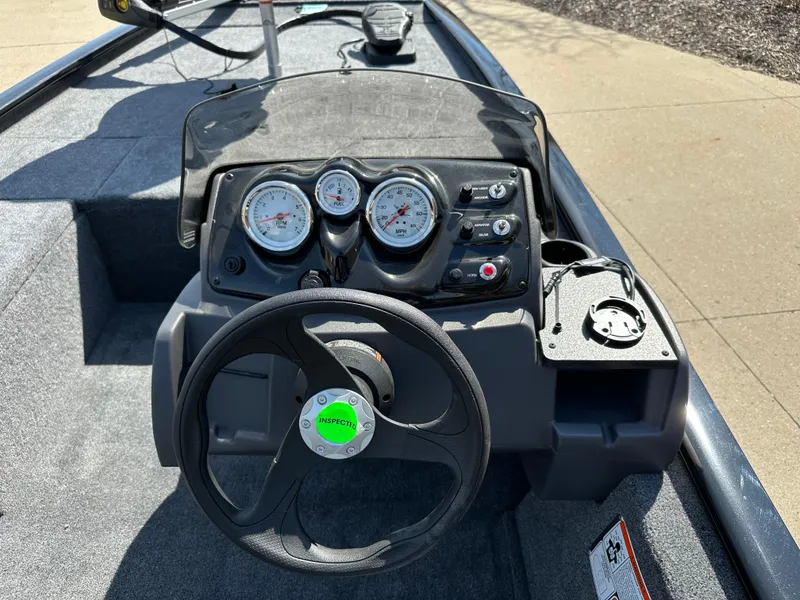 Slide: The Image of 2025 Tracker Pro 170 boat dashboard with steering wheel and gauges. - 5