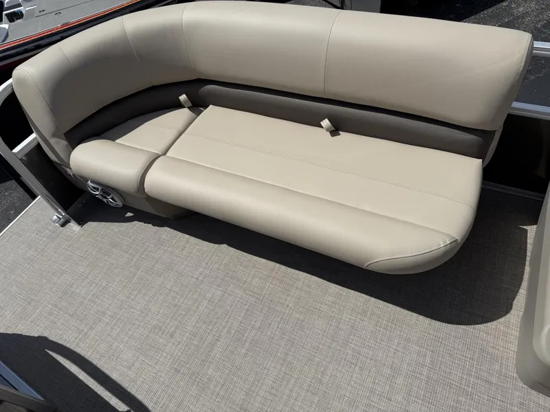 Slide: The Image of 2025 Sun Tracker Party Barge 16 DLX beige seating on a pontoon boat. - 10