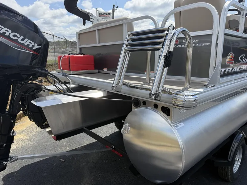 Slide: The Image of 2025 Sun Tracker Party Barge 16 DLX pontoon boat with Mercury engine, rear view. - 13