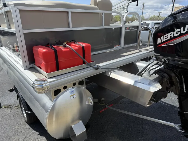 Slide: The Image of 2025 Sun Tracker Party Barge 16 DLX with Mercury outboard motor and red fuel tank. - 4