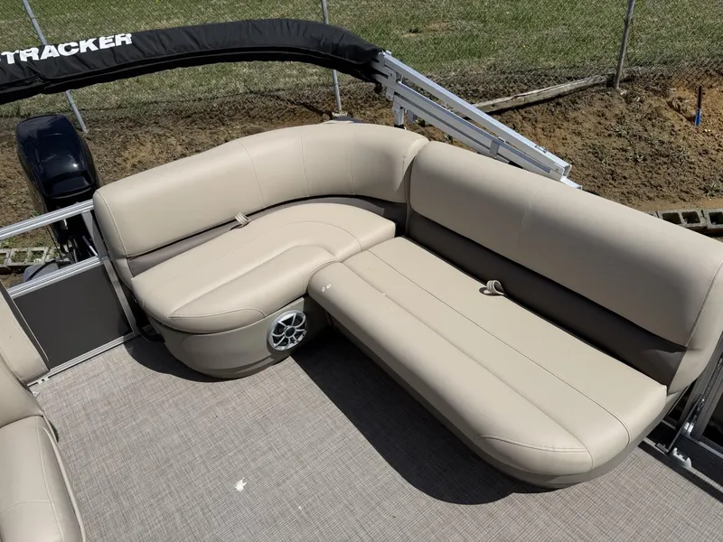 Slide: The Image of 2025 Sun Tracker Party Barge 16 DLX with beige seating and spacious deck. - 6