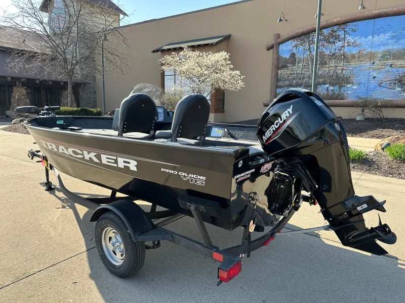Slide: The Image of 2025 Tracker Pro Guide V-16 SC boat with Mercury engine on trailer. - 2