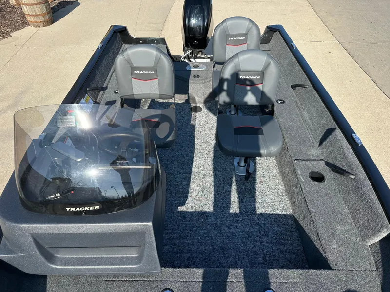 Slide: The Image of 2025 Tracker Pro Guide V-16 SC boat interior with seating and console. - 6