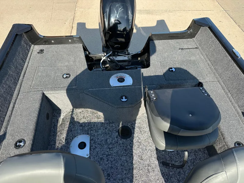 Slide: The Image of 2025 Tracker Pro Guide V-16 SC boat interior with seating and motor. - 7