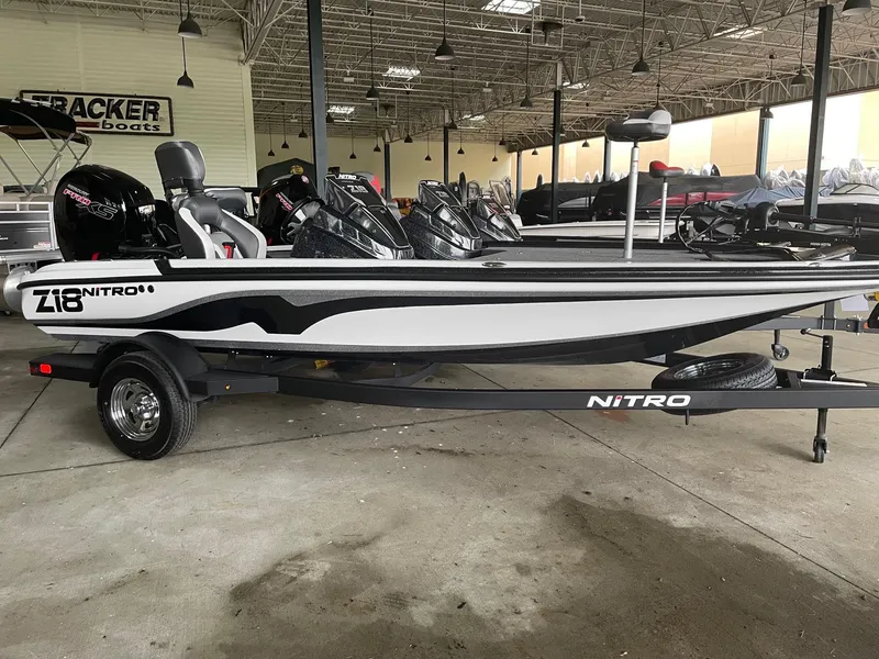 The Image of 2025 Nitro Z18 boat in showroom, sleek design, black and white color scheme. - 0
