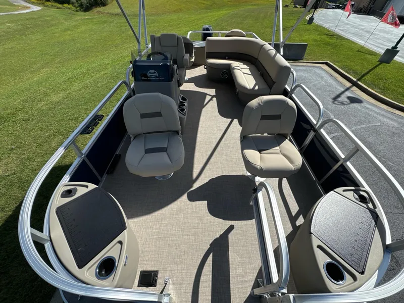 Slide: The Image of 2025 Sun Tracker Bass Buggy 18 DLX pontoon boat with spacious seating and modern design. - 6