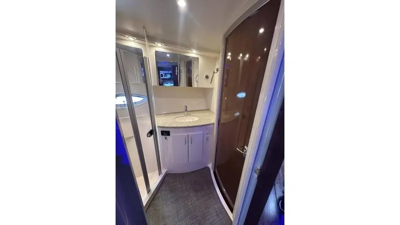 Slide: The Image of 2009 Carver 36 Mariner bathroom with modern fixtures and curved shower door. - 12