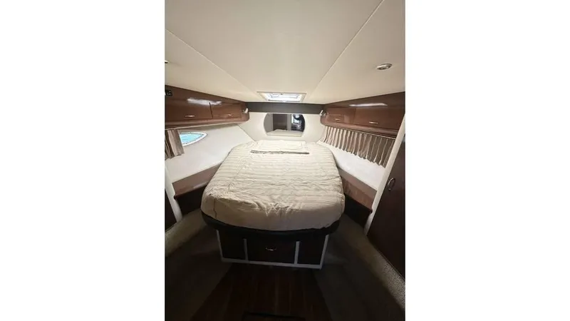 Slide: The Image of Interior cabin of 2009 Carver 36 Mariner with bed and wooden accents. - 15