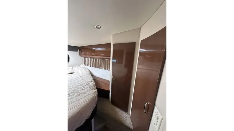 Slide: The Image of Interior cabin of 2009 Carver 36 Mariner with wood paneling and bed. - 17