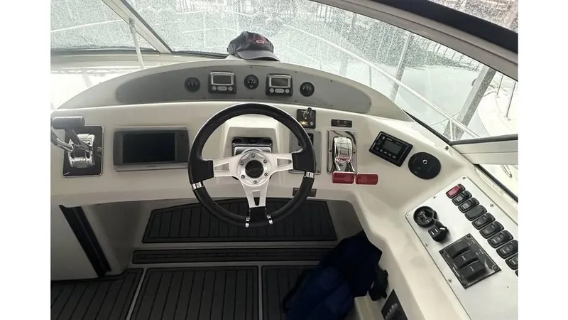 Slide: The Image of Helm of 2009 Carver 36 Mariner yacht with steering wheel and control panel. - 5