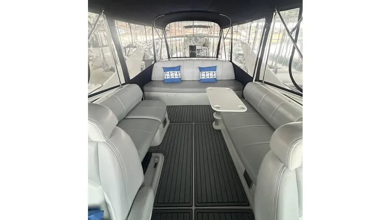 Slide: The Image of 2009 Carver 36 Mariner interior with spacious seating and table, featuring modern design. - 7